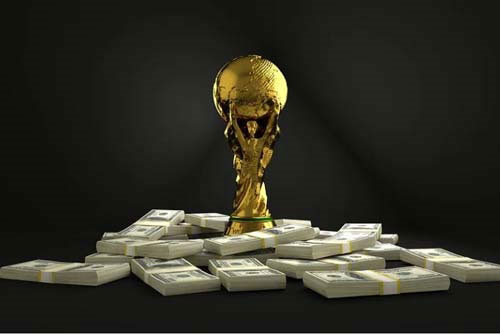 The World Cup trophy on a bunch of money